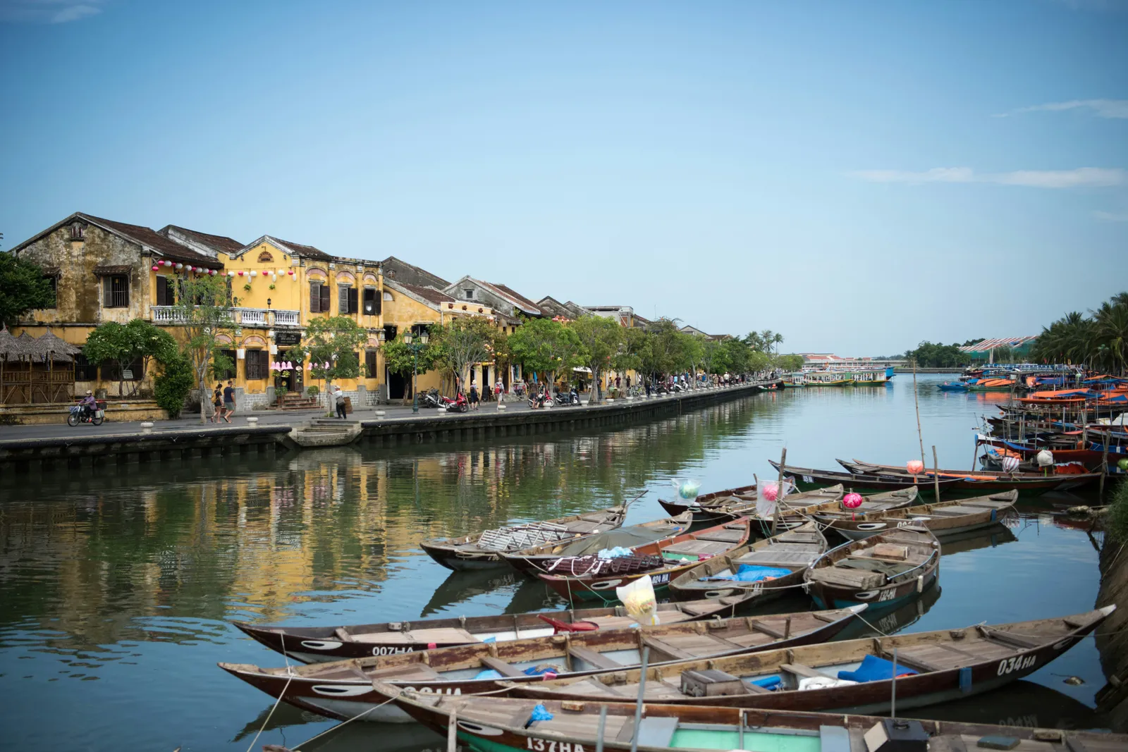 Wooden boats on the river in front of Hoi An's old town