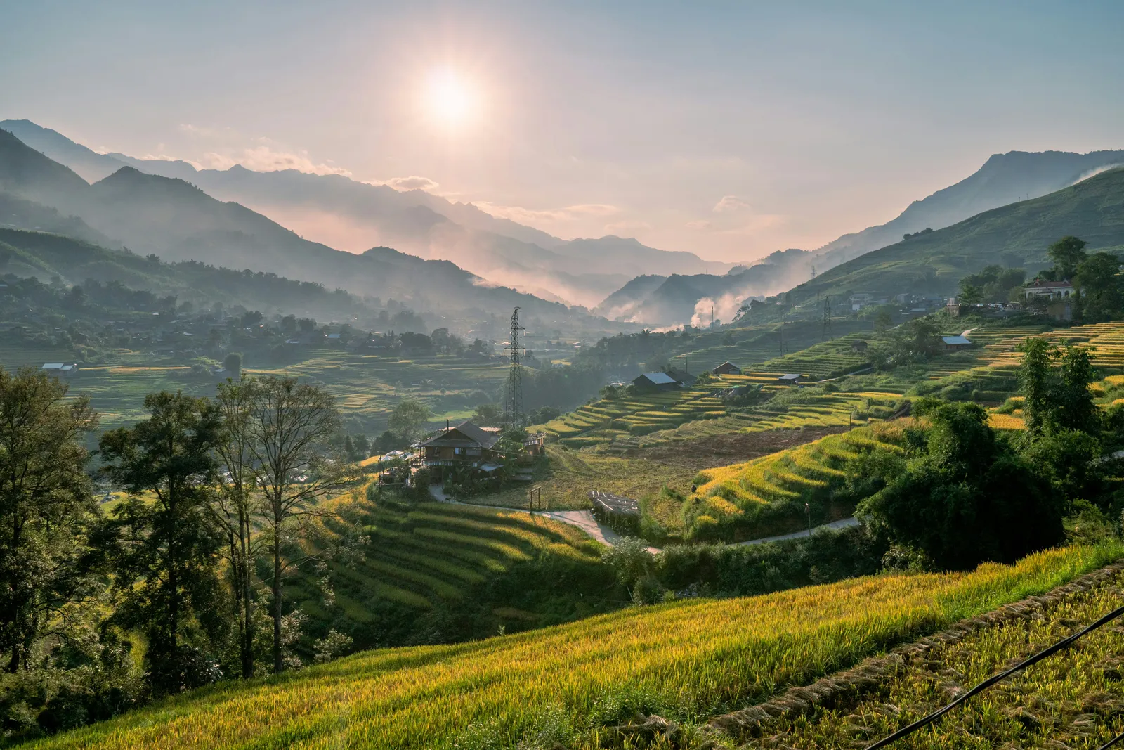 Terraced fields and mountain ridges in morning haze